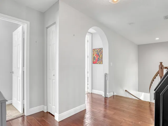 a large bed sitting in a bedroom next to a blue wall