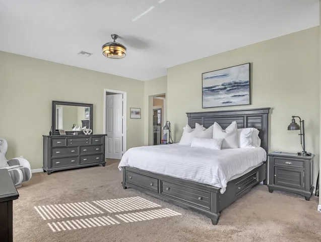 a view of a house with swimming pool and sitting area