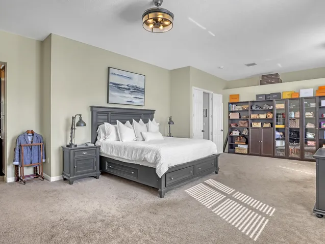 a view of a house with pool and sitting area