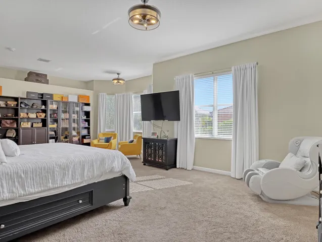 a front view of a house with sitting area and garden