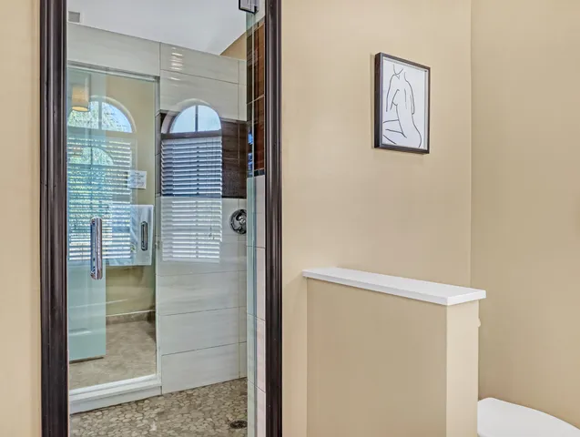 an aerial view of residential houses with city view