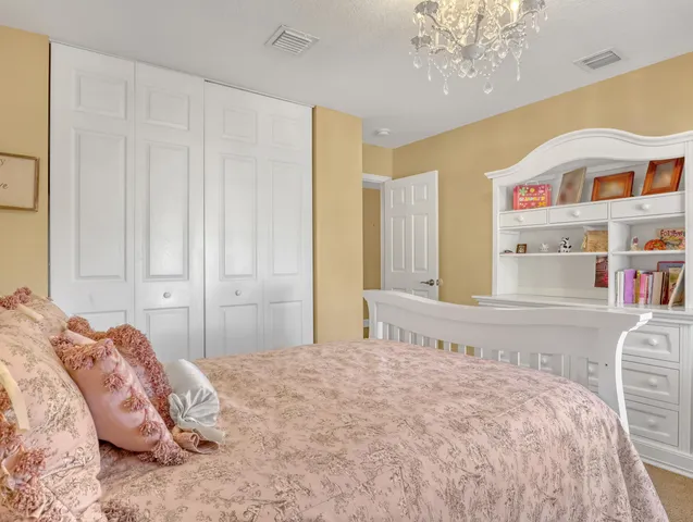 an aerial view of residential houses with outdoor space and swimming pool