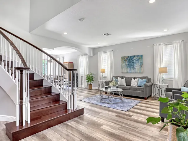 a living room with furniture and a table