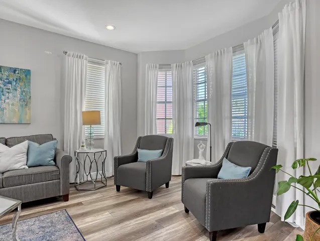 a view of entryway dining room and hall with wooden floor