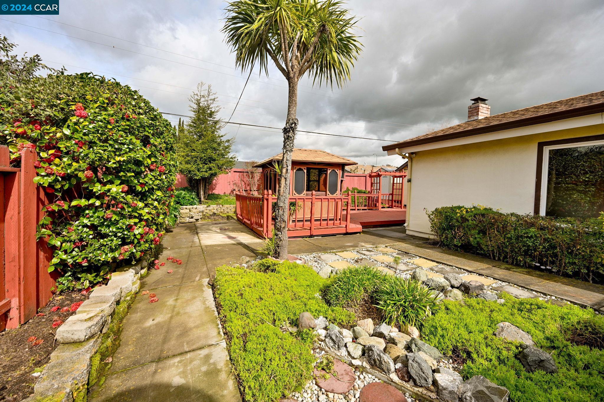 Undisclosed Address Dublin, CA 94568 - Photo 24 of 28 a front view of a house with garden