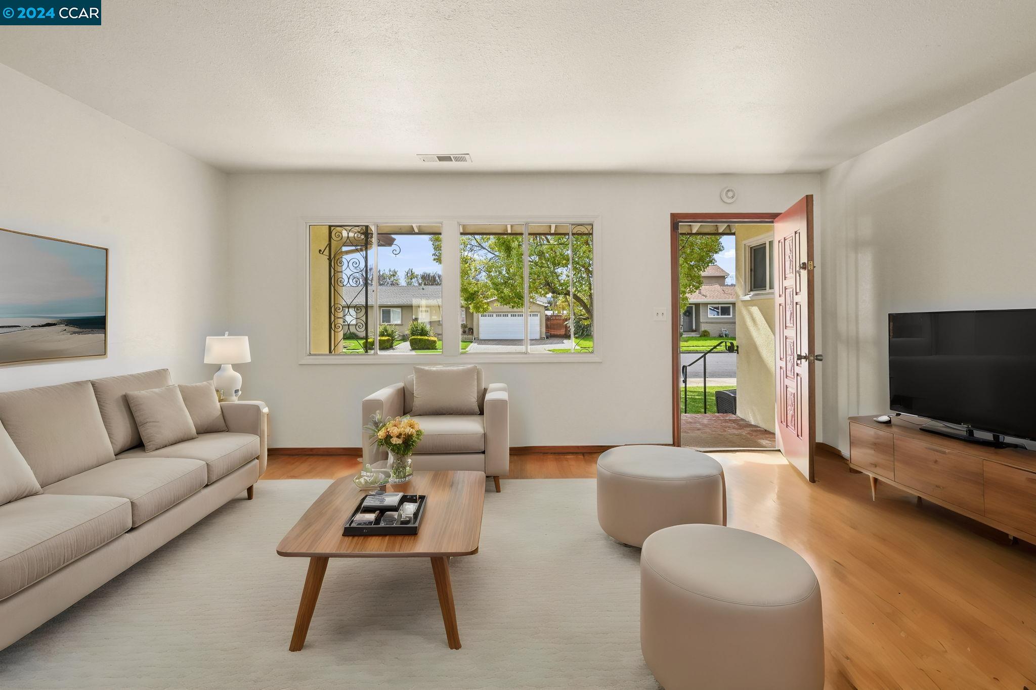Undisclosed Address Dublin, CA 94568 - Photo 5 of 28 a living room with furniture and a flat screen tv