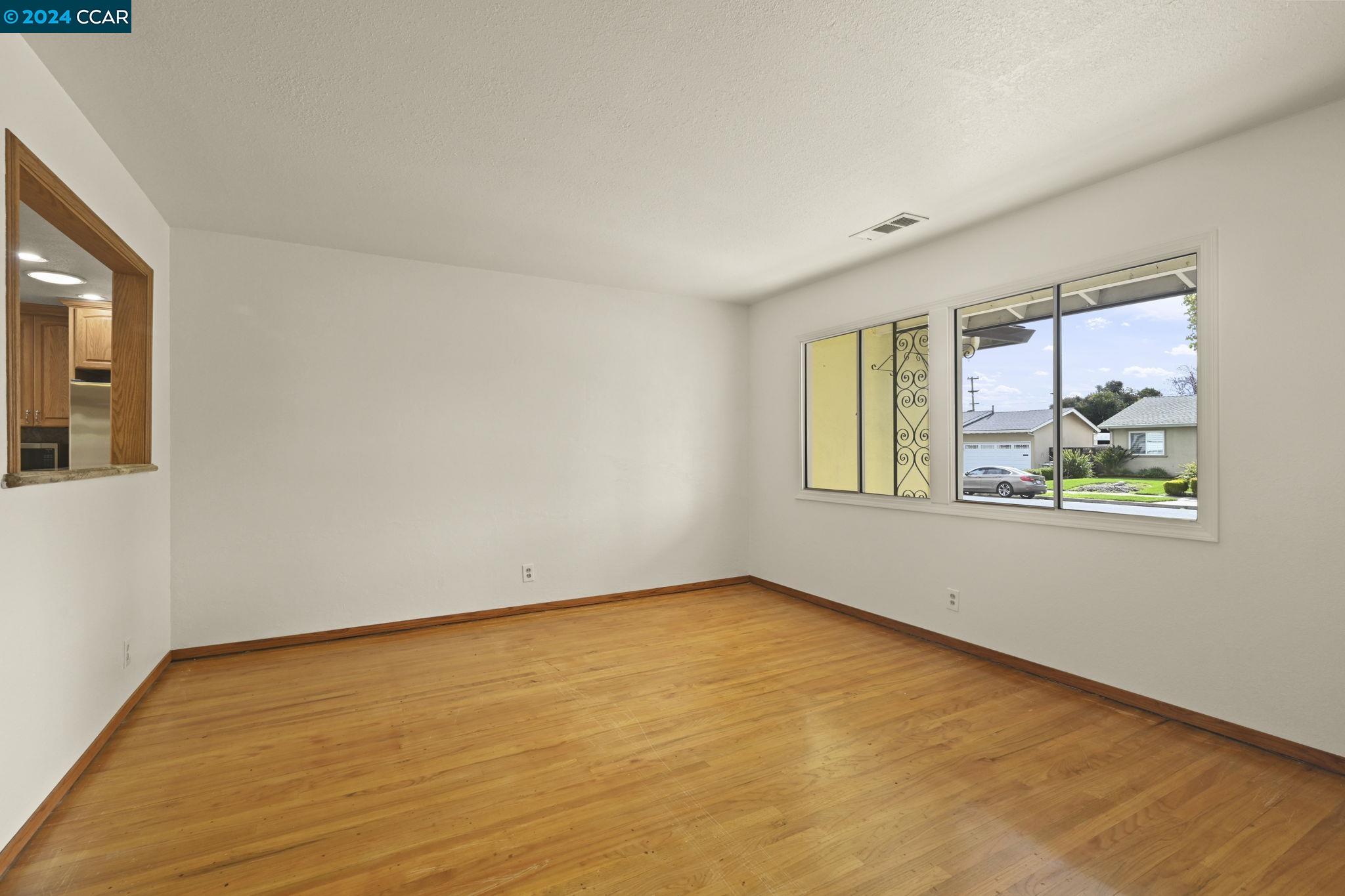 Undisclosed Address Dublin, CA 94568 - Photo 7 of 28 a view of an empty room with a window