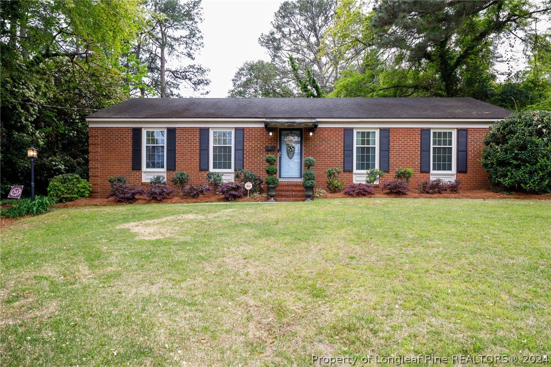 2519 Huntington Road Fayetteville, NC 28303 - Photo 1 of 36 a front view of house with yard outdoor seating and green space