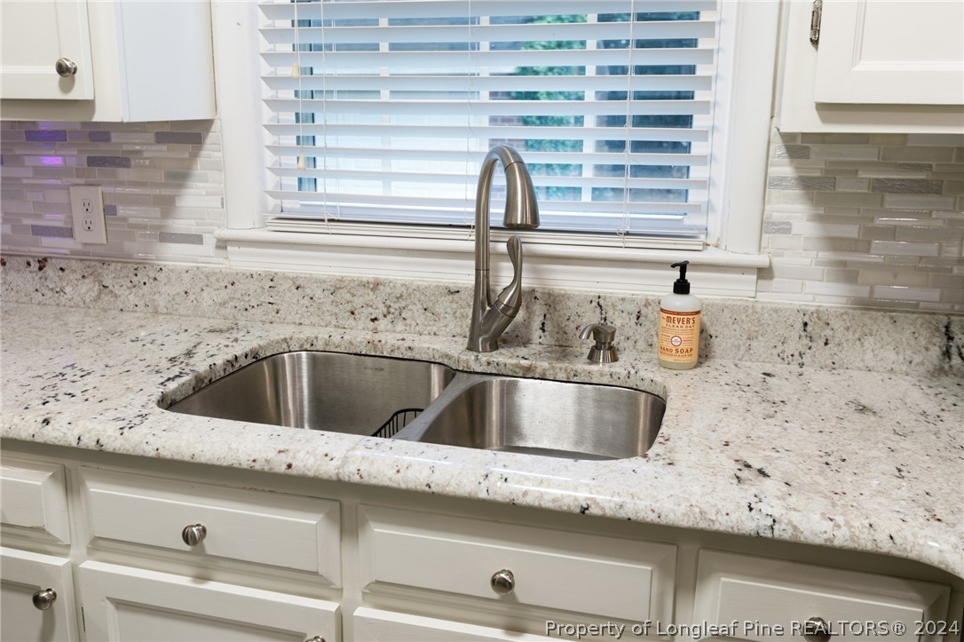 2519 Huntington Road Fayetteville, NC 28303 - Photo 12 of 36 a view closed with granite countertop a sink and a window
