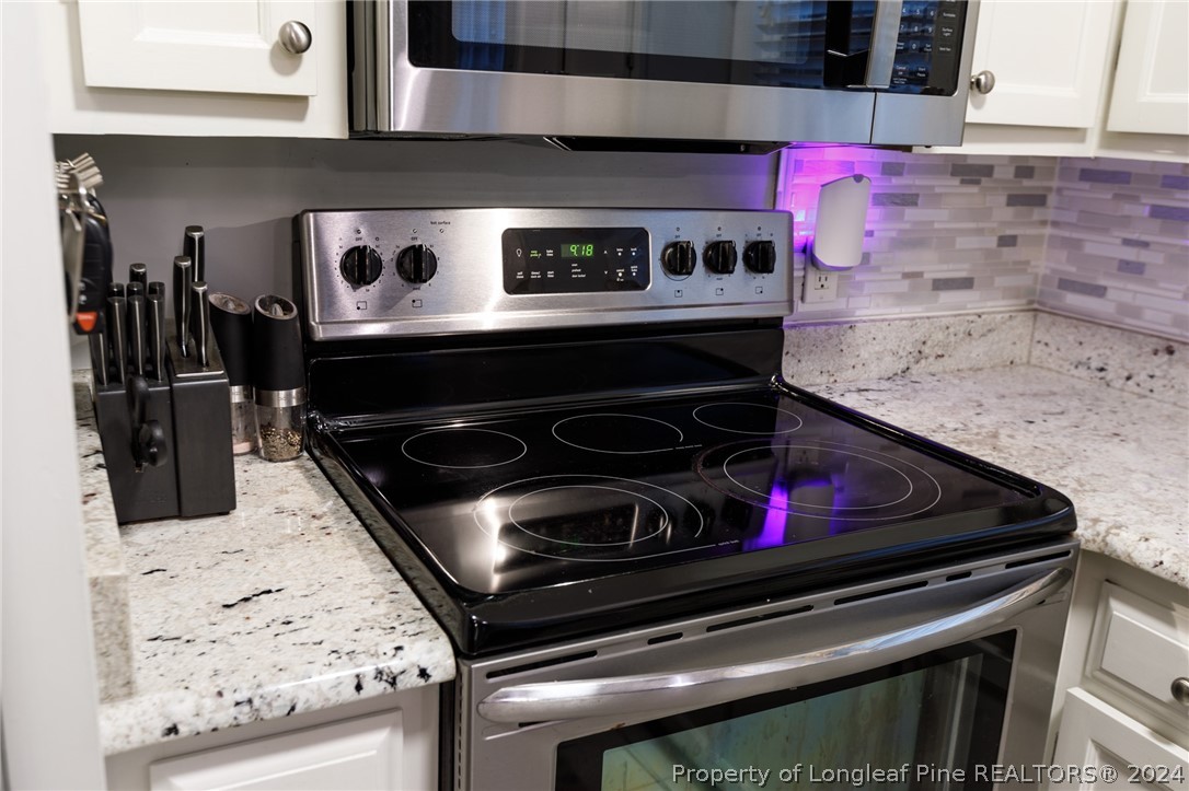 2519 Huntington Road Fayetteville, NC 28303 - Photo 13 of 36 a stove top oven sitting inside of a kitchen