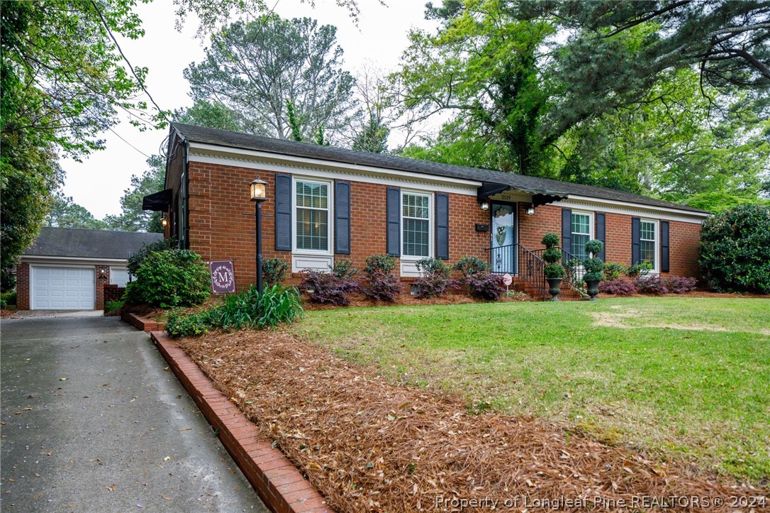2519 Huntington Road Fayetteville, NC 28303 - Photo 2 of 36 a view of backyard of house with green space