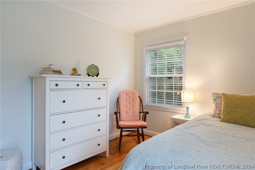 2519 Huntington Road Fayetteville, NC 28303 - Photo 21 of 36 a bedroom with a bed and chair