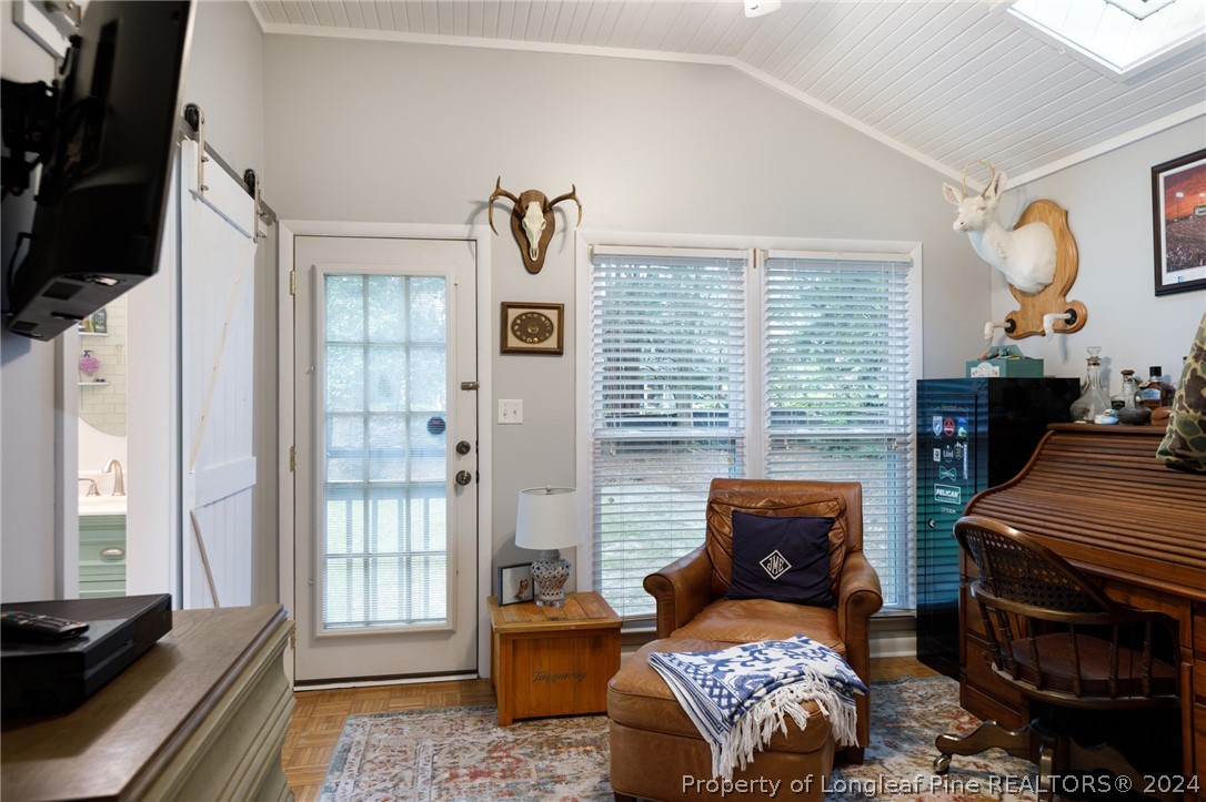 2519 Huntington Road Fayetteville, NC 28303 - Photo 26 of 36 a bedroom with furniture and a fireplace