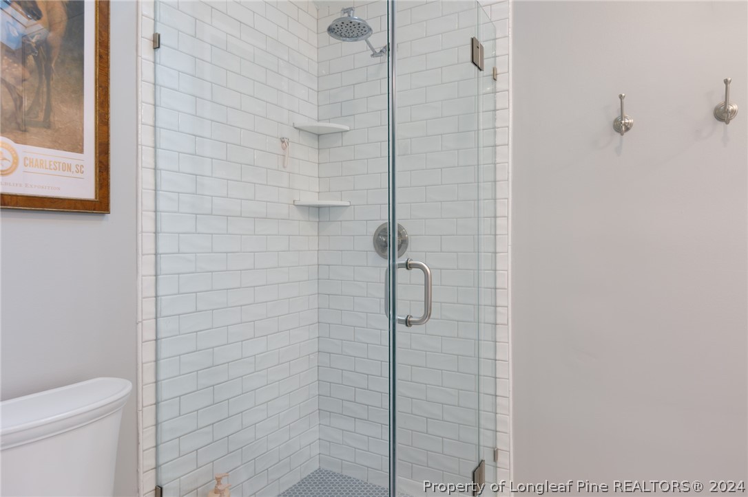 2519 Huntington Road Fayetteville, NC 28303 - Photo 30 of 36 a bathroom with a shower