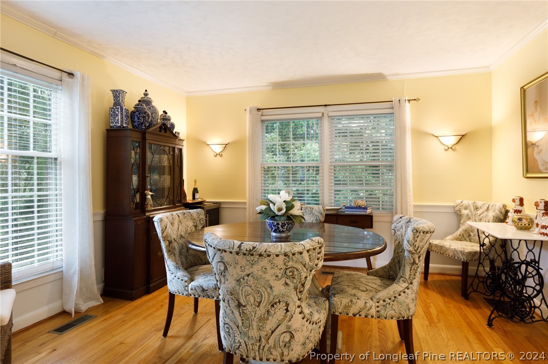 2519 Huntington Road Fayetteville, NC 28303 - Photo 7 of 36 a dining room with furniture and wooden floor