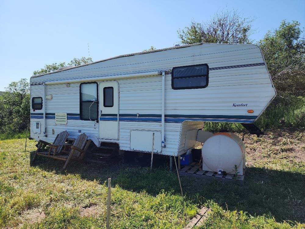 Lot 18 Harrison Creek Road Collbran, CO 81624 - Photo 18 of 30 a aerial view of a house with yard and trees in the background