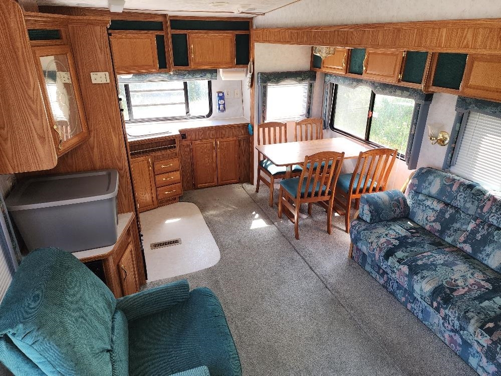 Lot 18 Harrison Creek Road Collbran, CO 81624 - Photo 26 of 30 a balcony with furniture a rug and a window