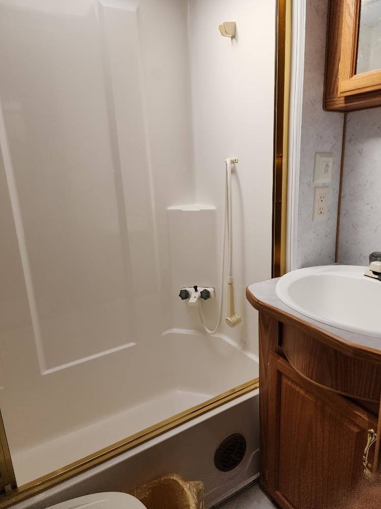 Lot 18 Harrison Creek Road Collbran, CO 81624 - Photo 29 of 30 a bathroom with a sink and a mirror