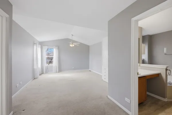 a view of empty room with a fireplace