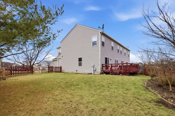 a view of a house with a yard and garage