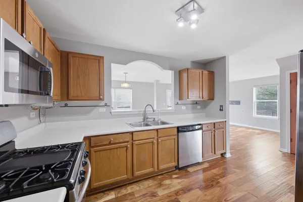 a kitchen with granite countertop a stove and a sink