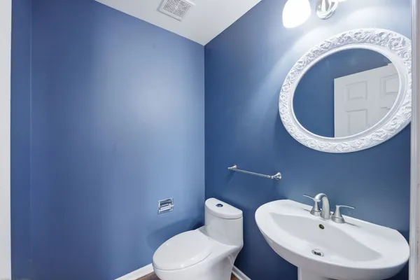 a bathroom with a toilet and a sink