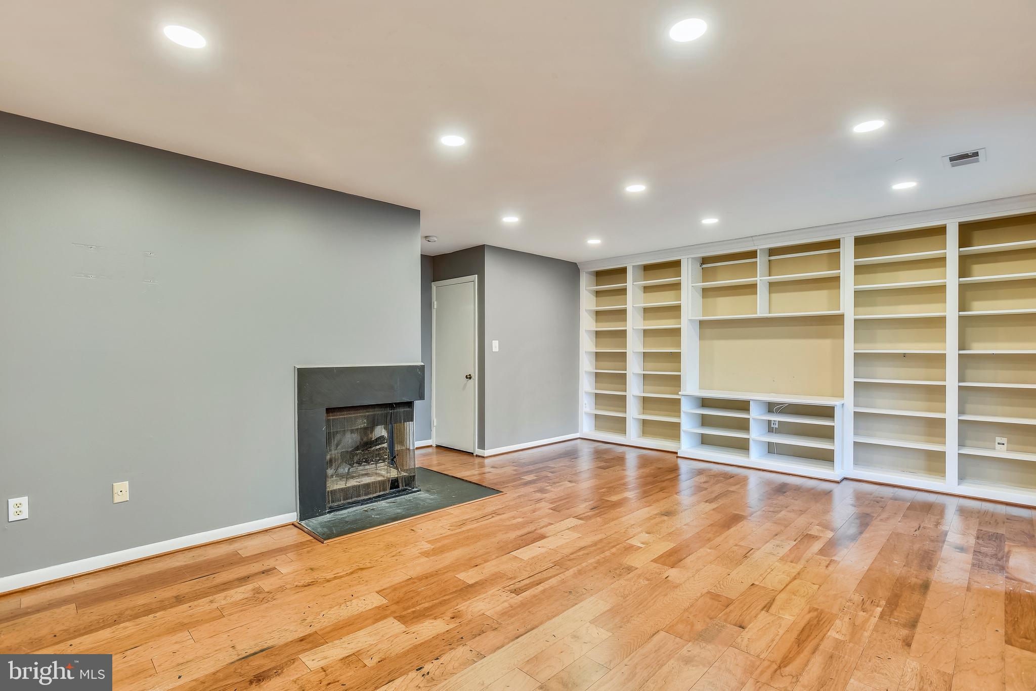 2051 Swans Neck Way Reston, VA 20191 - Photo 23 of 35 Large open family room in basement with built-ins