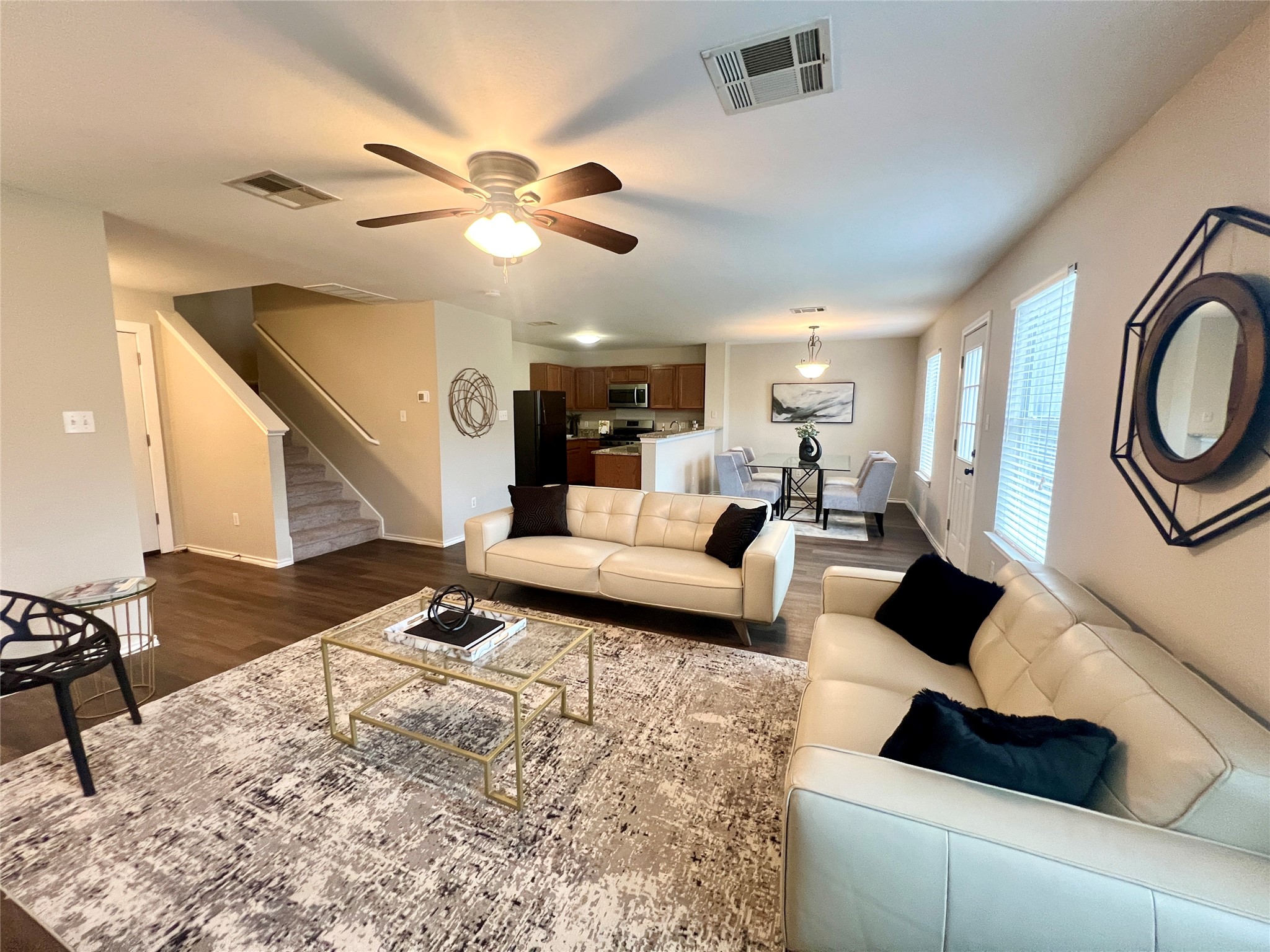 Wide open floorplan flows seamlessly from living, to dining and kitchen areas