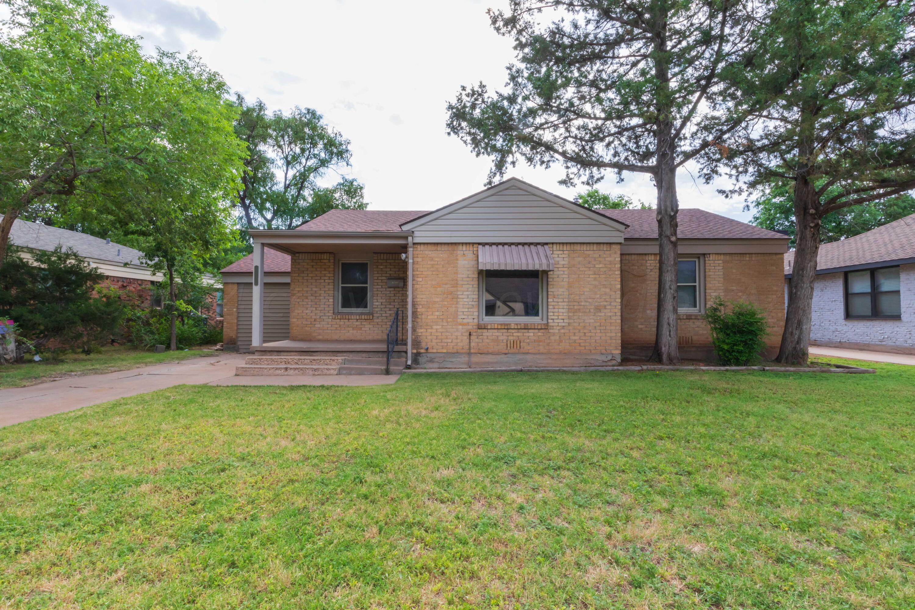 a front view of a house with yard