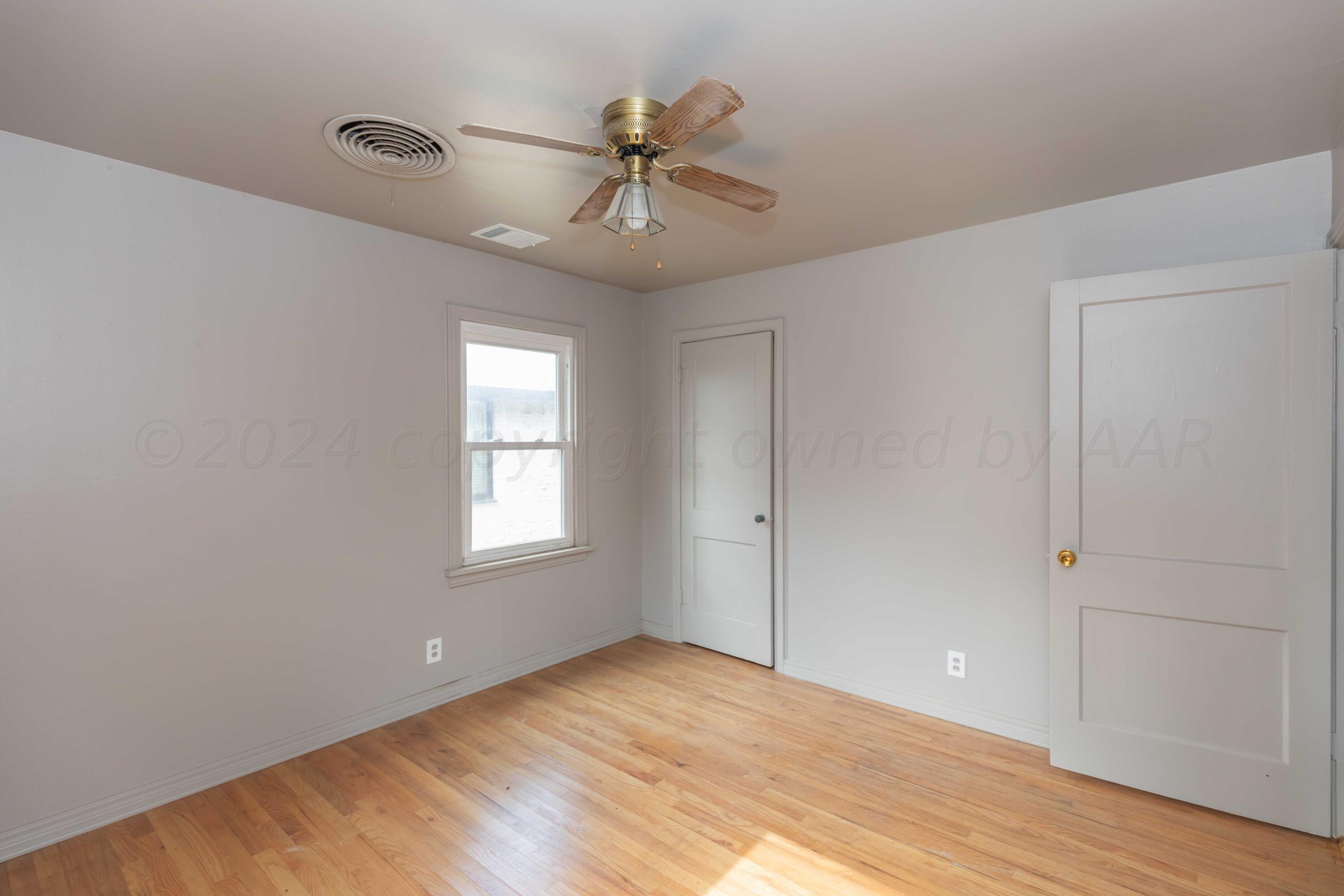1613 South Travis Street Amarillo, TX 79102 - Photo 27 of 49 a view of an empty room with a window