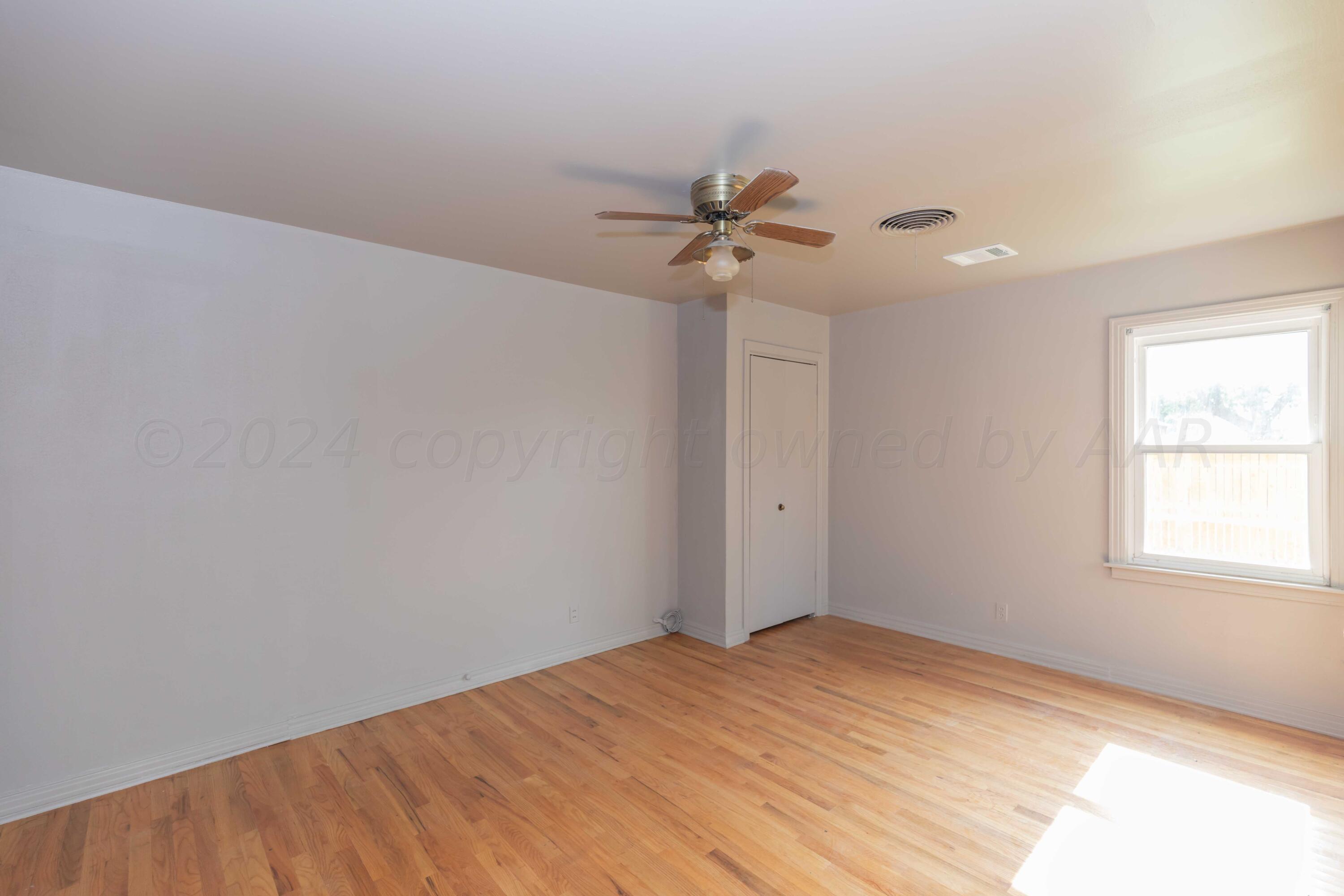 1613 South Travis Street Amarillo, TX 79102 - Photo 31 of 49 a view of empty room with windows