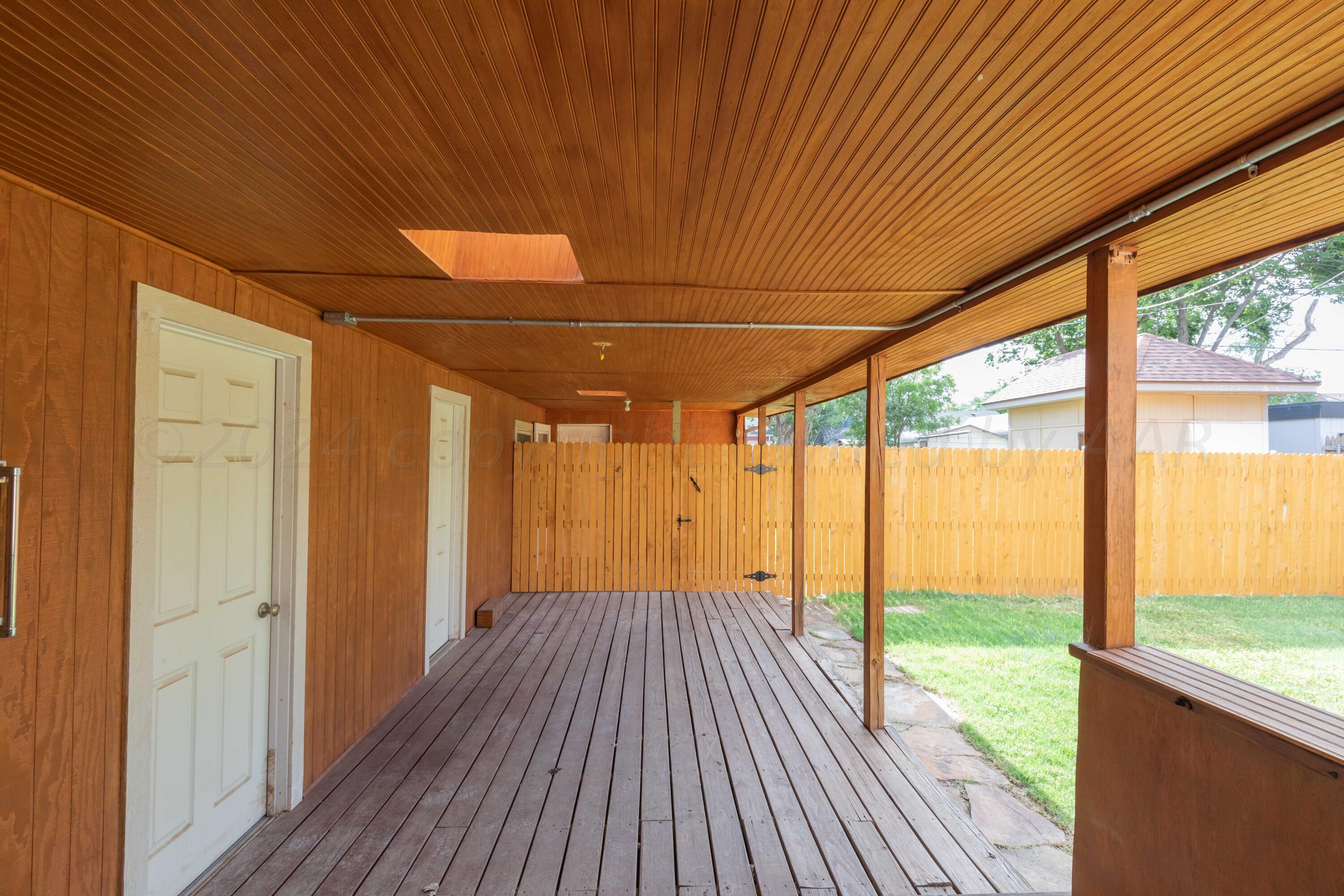 1613 South Travis Street Amarillo, TX 79102 - Photo 34 of 49 a view of a room with wooden floor and windows