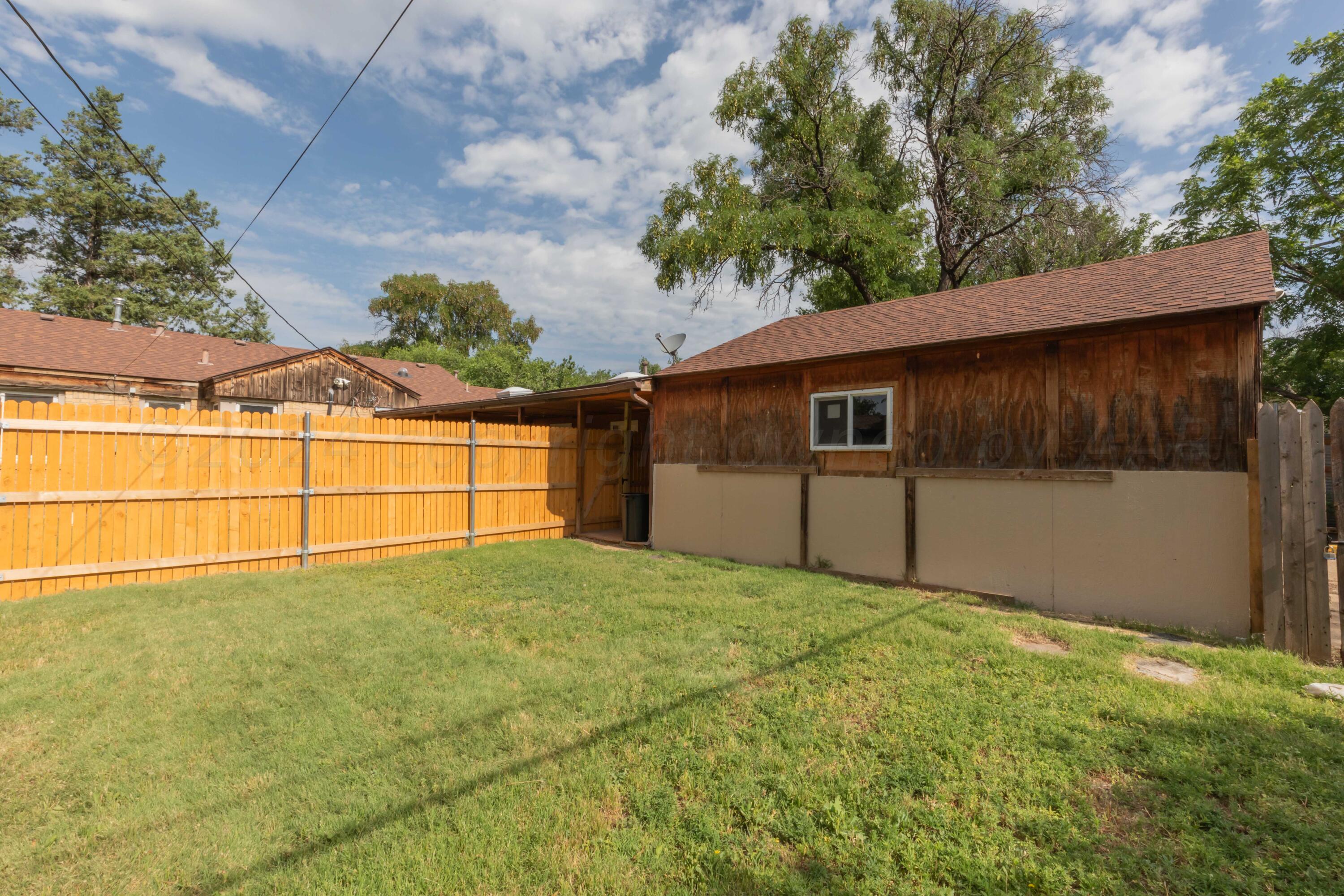 1613 South Travis Street Amarillo, TX 79102 - Photo 37 of 49 a view of a backyard