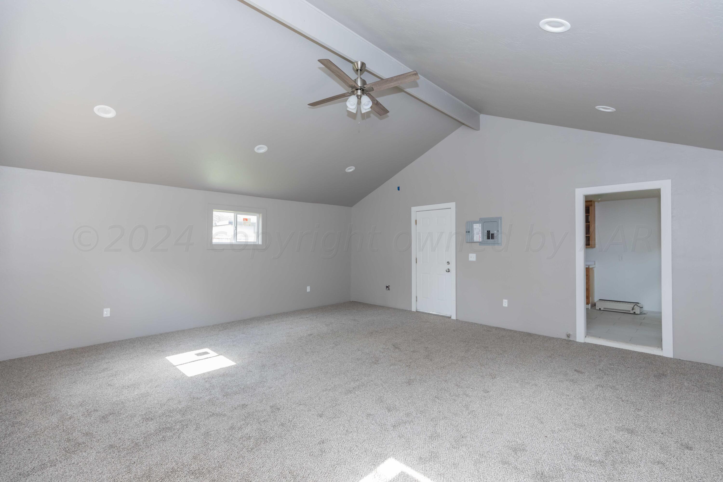 1613 South Travis Street Amarillo, TX 79102 - Photo 40 of 49 a view of an empty room with a window