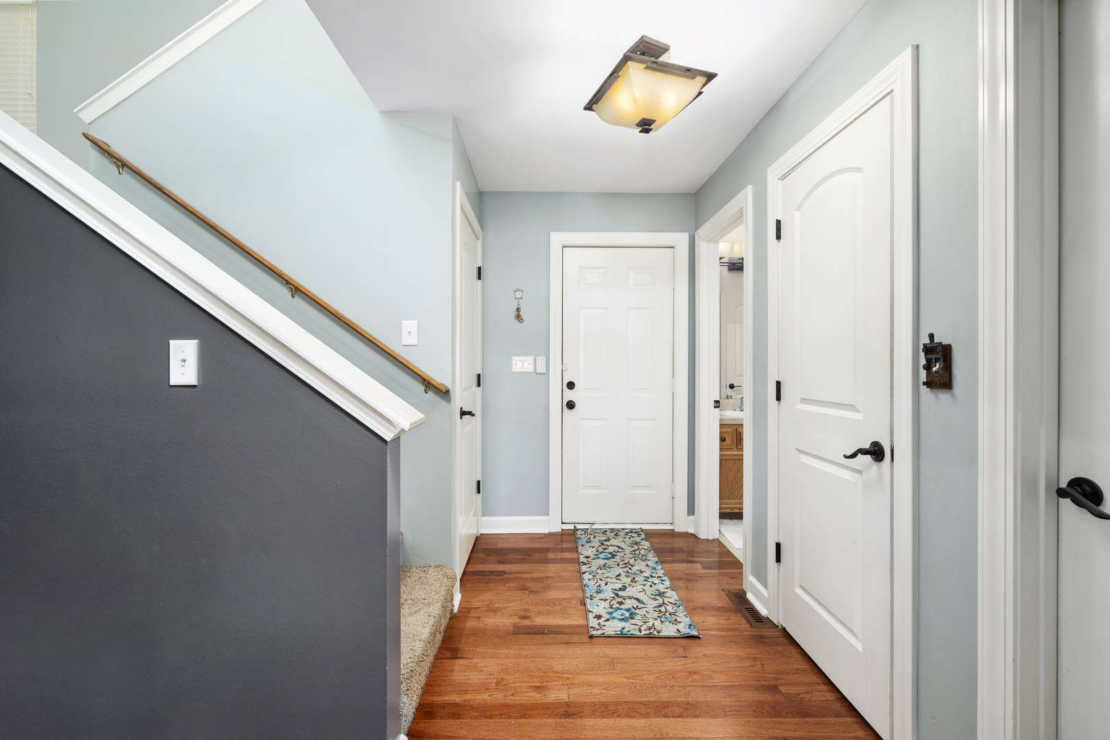 284 South Will Road Diamond, IL 60416 - Photo 13 of 23 a view of a hallway with wooden floor and closet