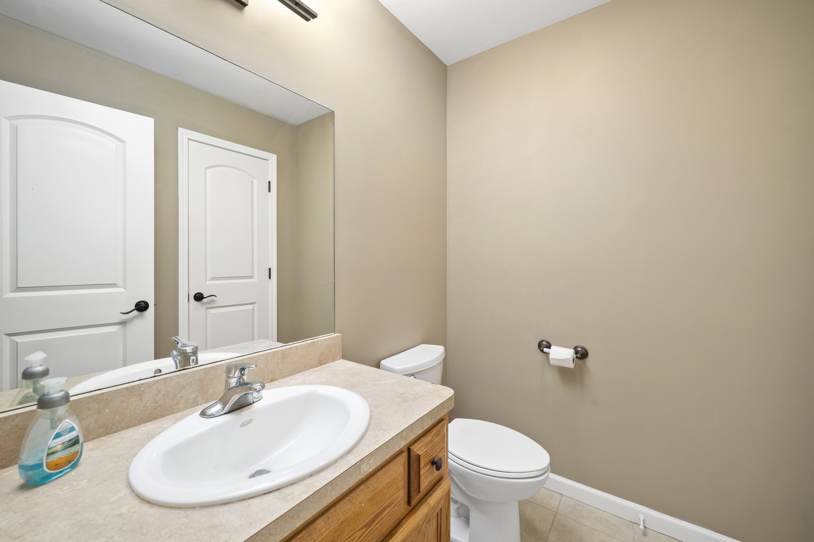 284 South Will Road Diamond, IL 60416 - Photo 14 of 23 a bathroom with a sink and a toilet