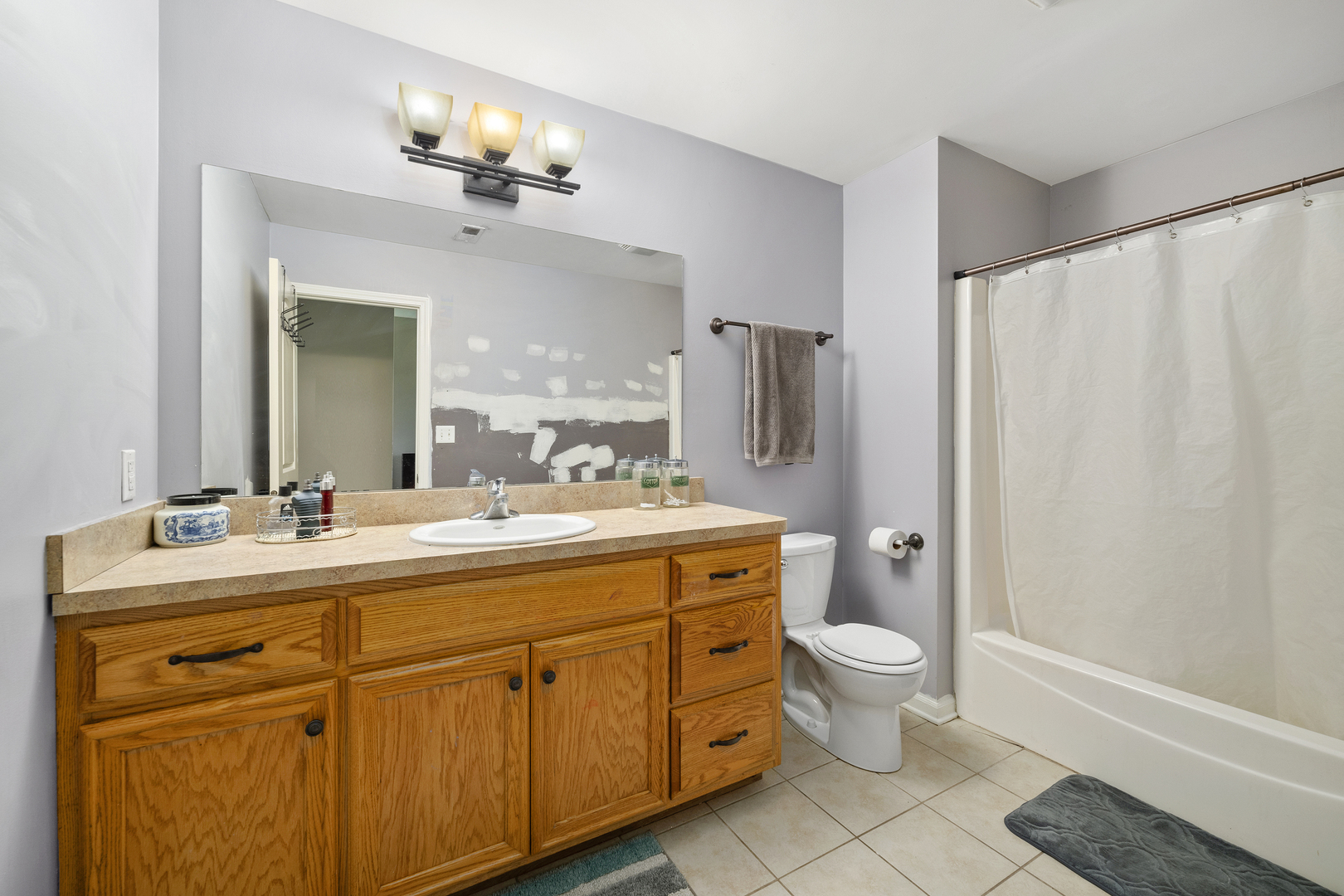 284 South Will Road Diamond, IL 60416 - Photo 16 of 23 a bathroom with a double vanity sink mirror and toilet