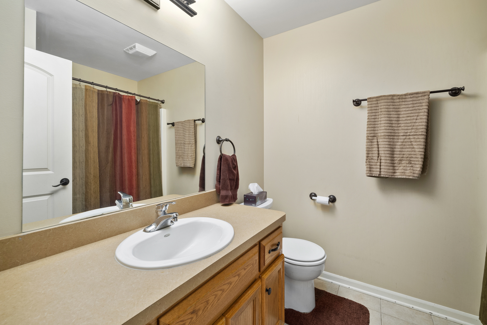 284 South Will Road Diamond, IL 60416 - Photo 20 of 23 a bathroom with a granite countertop sink toilet and shower