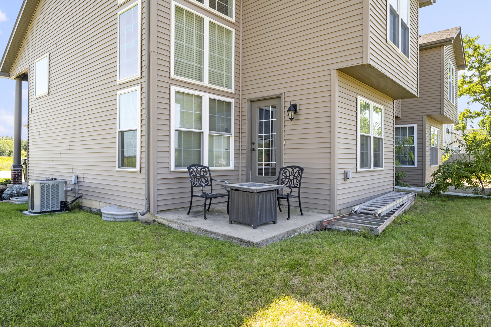 284 South Will Road Diamond, IL 60416 - Photo 21 of 23 a view of a chair and table in backyard of the house
