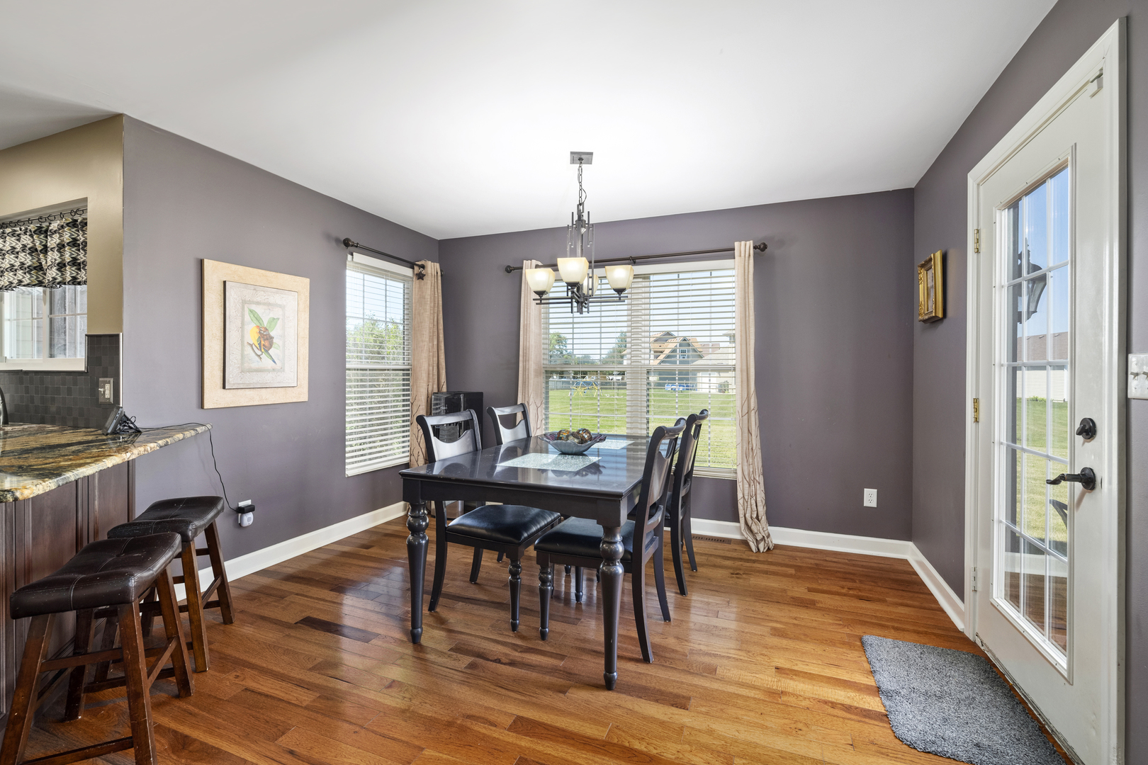 284 South Will Road Diamond, IL 60416 - Photo 7 of 23 a view of a dining room with furniture window and wooden floor