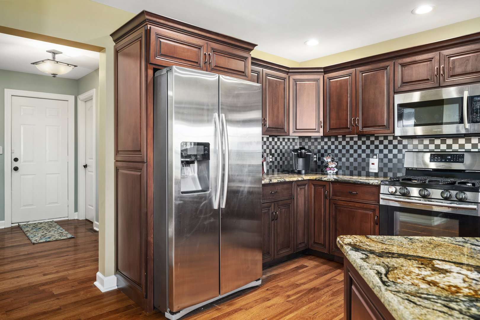 284 South Will Road Diamond, IL 60416 - Photo 10 of 23 a kitchen with stainless steel appliances granite countertop a refrigerator and a stove top oven