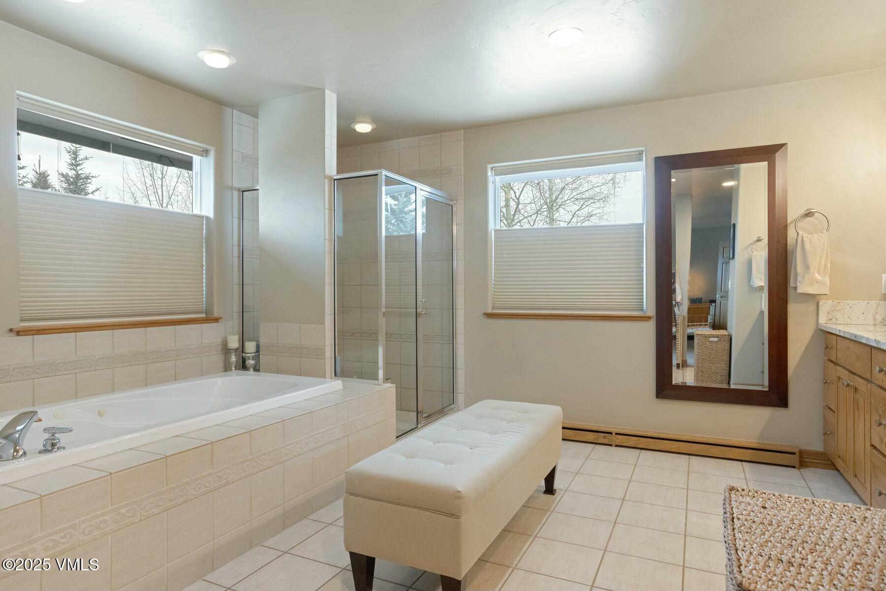85 Remington Trail Edwards, CO 81632 - Photo 21 of 41 a spacious bathroom with a bathtub and a shower