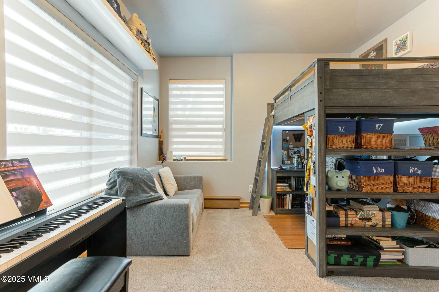 85 Remington Trail Edwards, CO 81632 - Photo 31 of 41 a living room with furniture and a book shelf