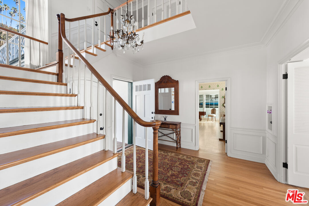 605 Palisades Beach Road Santa Monica, CA 90402 - Photo 19 of 33 a view of entryway and hall with wooden floor