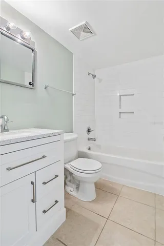 a bathroom with a toilet a sink and bathtub