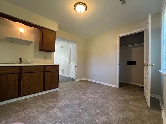 a room with a sink and a mirror