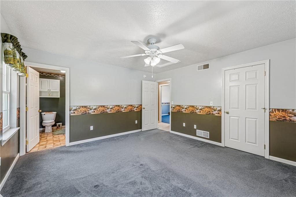 142 Poorbaugh Road Connellsville, PA 15425 - Photo 13 of 41 wooden floor and an empty room with a ceiling fan