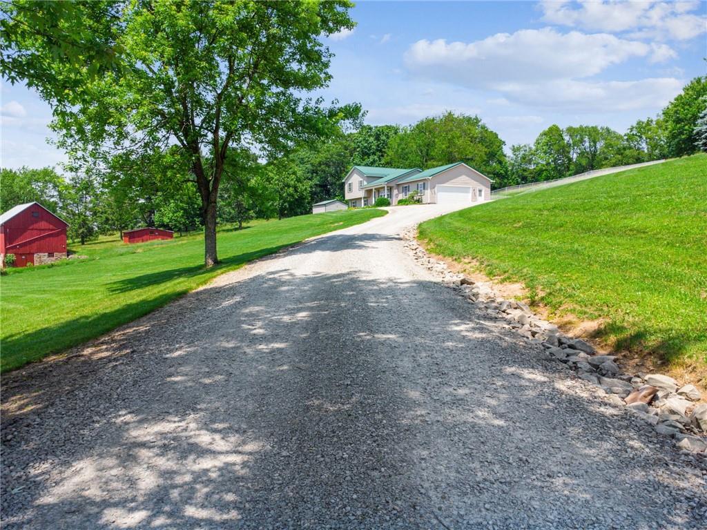 142 Poorbaugh Road Connellsville, PA 15425 - Photo 3 of 41 a view of a street with a houses in the background