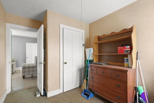 a room with a dresser and a mirror