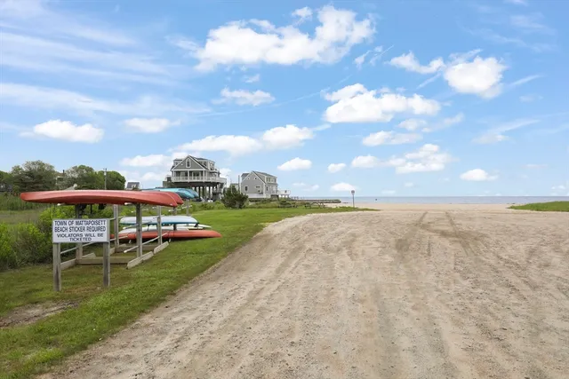 a view of a swimming pool with lawn chairs and a yard